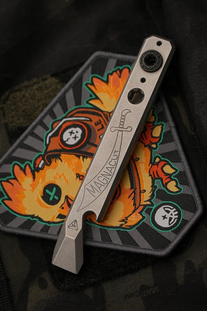 Services Sleek modern multitool resting on a colorful custom embroidered patch.